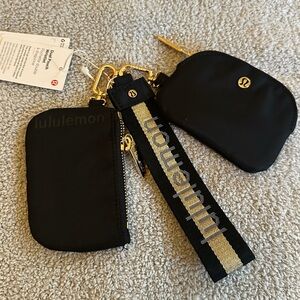 Lululemon Black and Gold Pouch Set